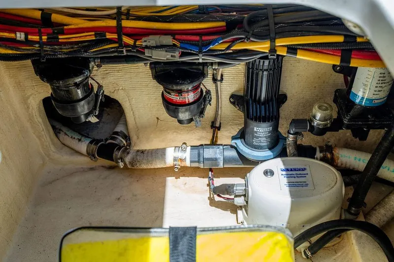  Yacht Photos Pics Engine compartment of 2022 Fountain 34 SC boat, showcasing wiring and plumbing systems.