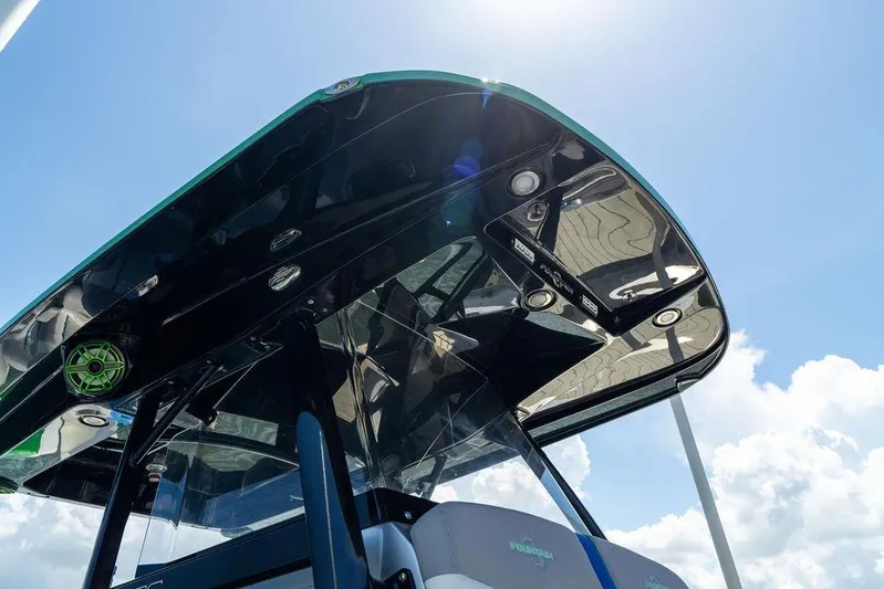  Yacht Photos Pics 2022 Fountain 34 SC boat canopy under bright blue sky.