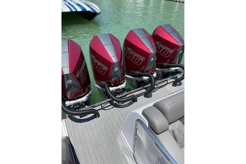  Yacht Photos Pics 2021 Mystic Powerboats M3800 with four red Mercury Racing outboard engines.