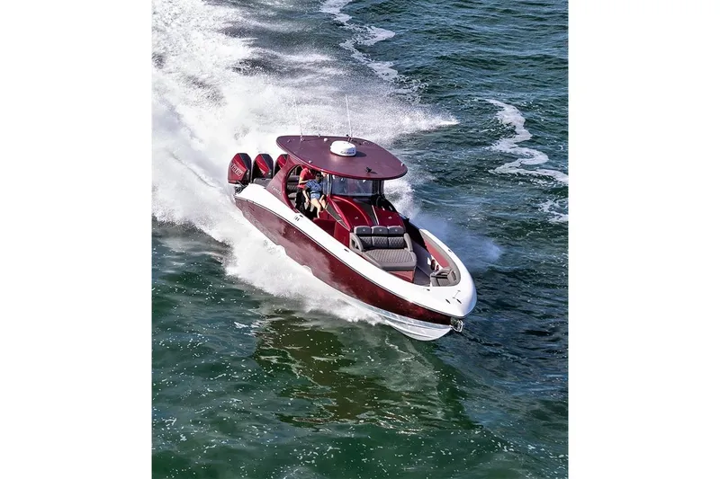  Yacht Photos Pics 2021 Mystic Powerboats M3800 speeding on open water, showcasing sleek design and powerful performance.