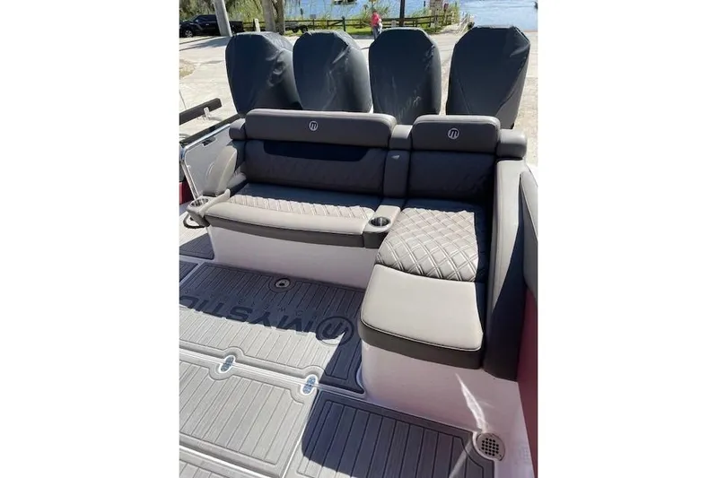  Yacht Photos Pics 2021 Mystic Powerboats M3800 interior with luxurious seating and cup holders.