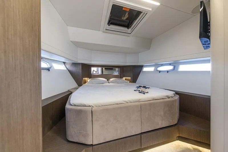  Yacht Photos Pics Luxurious cabin interior of 2025 Rio Yachts Le Mans 45 with modern design and cozy bed.