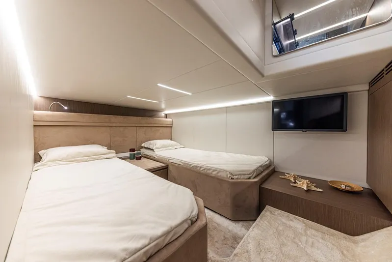  Yacht Photos Pics Luxurious cabin interior of 2025 Rio Yachts Le Mans 45 with twin beds and modern decor.