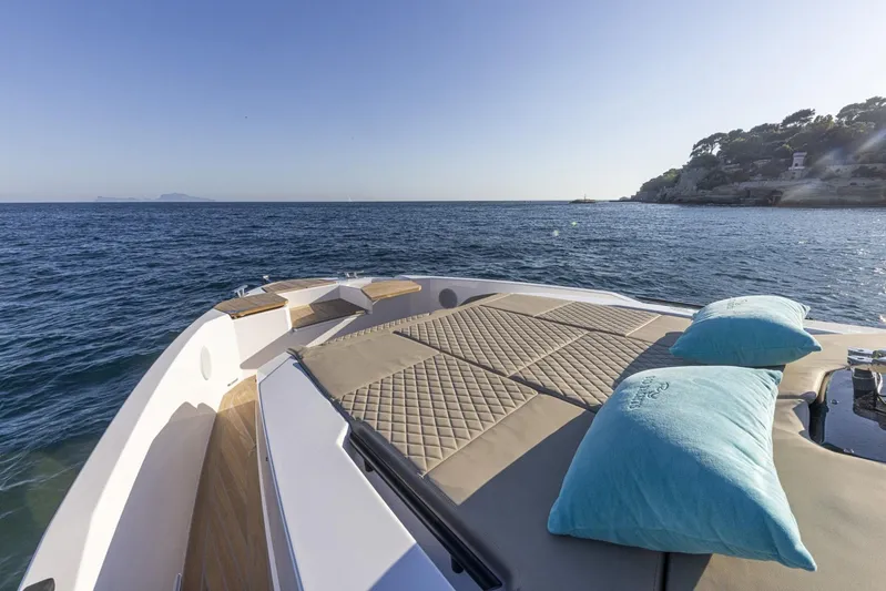  Yacht Photos Pics Luxurious 2025 Rio Yachts Le Mans 45 deck with cushions, overlooking serene ocean view.