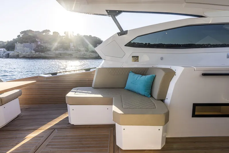  Yacht Photos Pics Luxurious seating area on 2025 Rio Yachts Le Mans 45, overlooking serene waters.