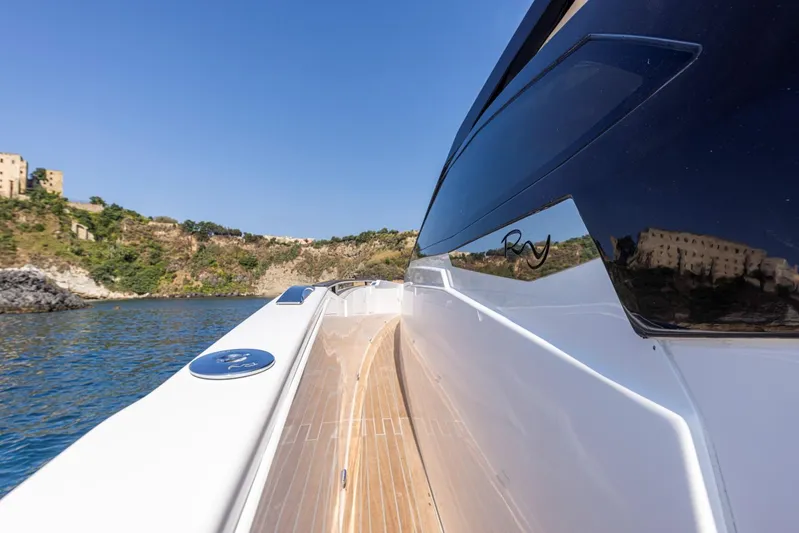  Yacht Photos Pics 2025 Rio Yachts Le Mans 45, sleek deck view, cruising near scenic coastline.