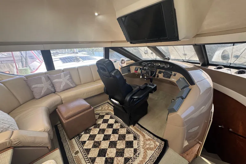 Once Around II Yacht Photos Pics Luxurious 1998 Carver 530 Voyager Pilothouse interior with helm, leather seating, and elegant decor.