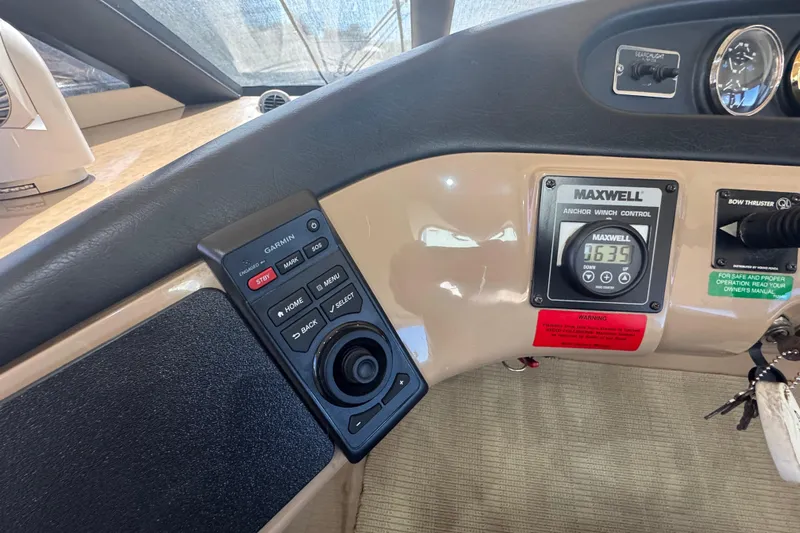 Once Around II Yacht Photos Pics Control panel of a 1998 Carver 530 Voyager Pilothouse with Garmin and Maxwell systems.