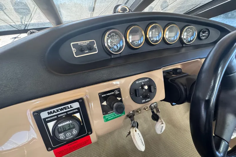 Once Around II Yacht Photos Pics Control panel of a 1998 Carver 530 Voyager Pilothouse with gauges and switches.