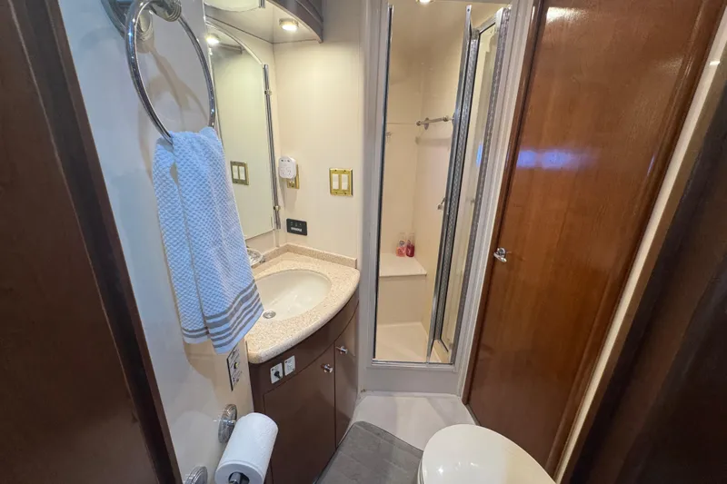 Once Around II Yacht Photos Pics Bathroom interior of 1998 Carver 530 Voyager Pilothouse with shower and sink.