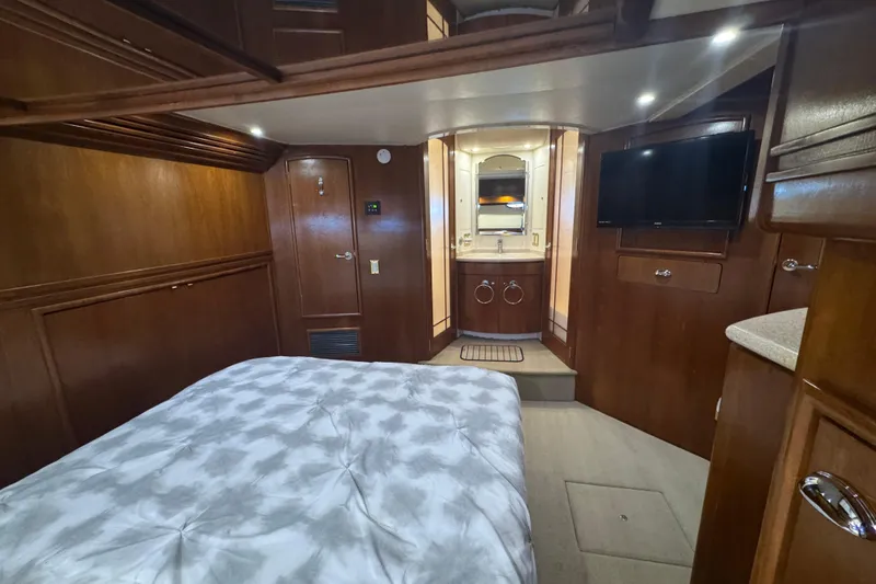 Once Around II Yacht Photos Pics Luxurious interior of 1998 Carver 530 Voyager Pilothouse with wood paneling and modern amenities.