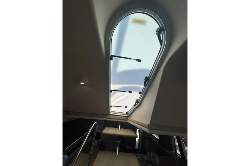 Once Around II Yacht Photos Pics Interior view of 1998 Carver 530 Voyager Pilothouse with skylight and stairs.