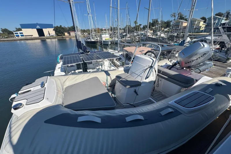 Once Around II Yacht Photos Pics 1998 Carver 530 Voyager Pilothouse docked, featuring inflatable boat and Honda outboard motor.
