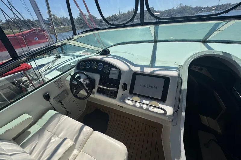 Once Around II Yacht Photos Pics 1998 Carver 530 Voyager Pilothouse helm with Garmin navigation system and leather seating.
