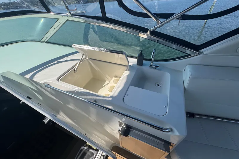 Once Around II Yacht Photos Pics 1998 Carver 530 Voyager Pilothouse interior with sink and storage compartment.