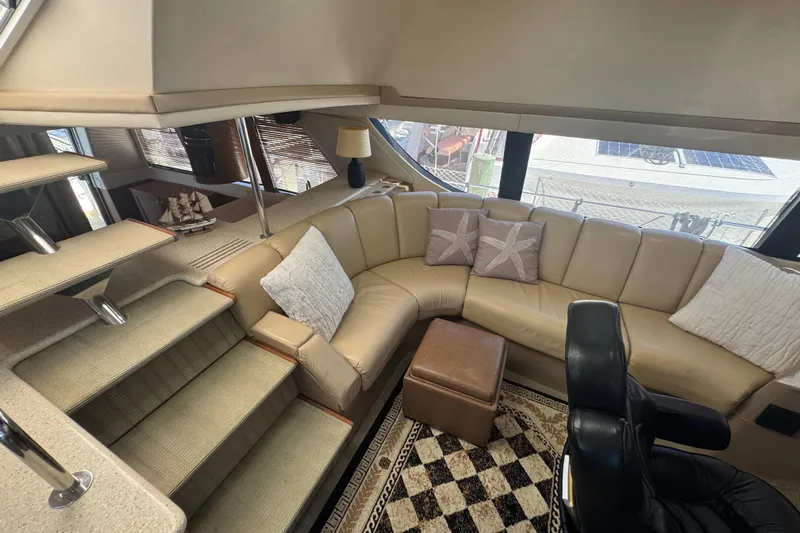 Once Around II Yacht Photos Pics Luxurious interior of 1998 Carver 530 Voyager Pilothouse with plush seating and elegant decor.