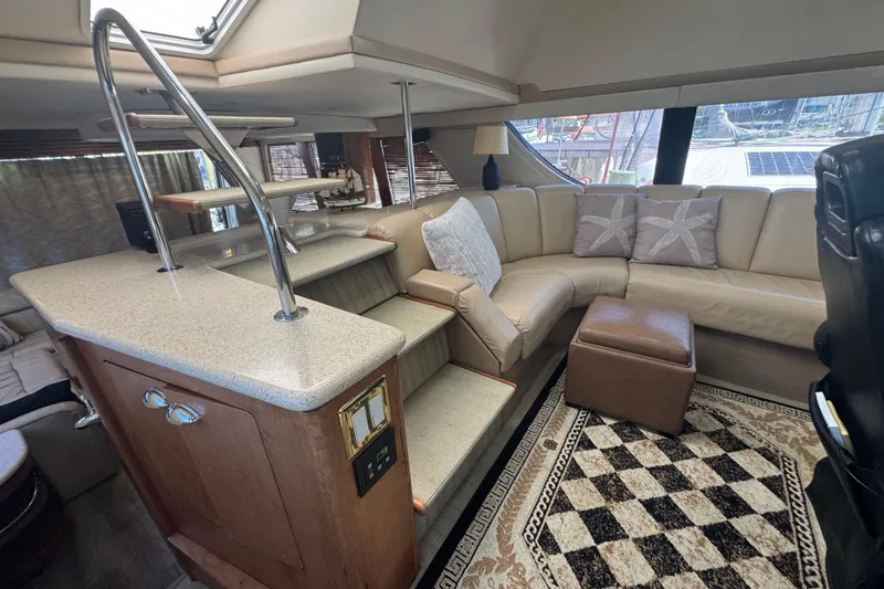 Once Around II Yacht Photos Pics Luxurious interior of 1998 Carver 530 Voyager Pilothouse with plush seating and elegant decor.