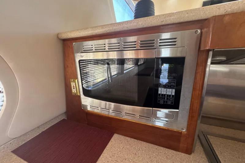 Once Around II Yacht Photos Pics Built-in microwave in 1998 Carver 530 Voyager Pilothouse kitchen area.