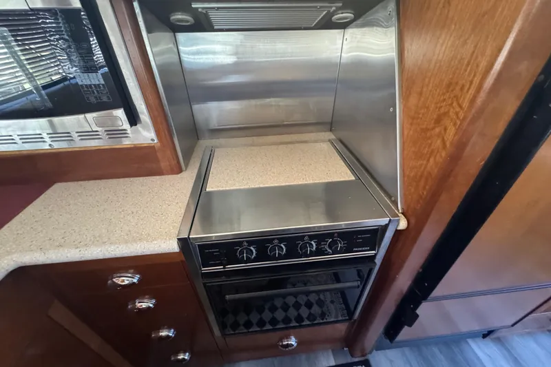 Once Around II Yacht Photos Pics 1998 Carver 530 Voyager Pilothouse kitchen with stove and countertop.