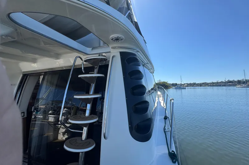 Once Around II Yacht Photos Pics 1998 Carver 530 Voyager Pilothouse yacht with spiral staircase, docked on a sunny day.