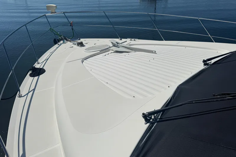 Once Around II Yacht Photos Pics 1998 Carver 530 Voyager Pilothouse yacht deck with railing and anchor.