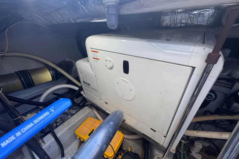 Once Around II Yacht Photos Pics Engine room of 1998 Carver 530 Voyager Pilothouse with Kohler power system.