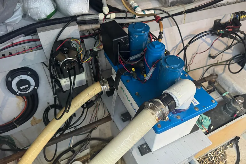 Once Around II Yacht Photos Pics Engine room of a 1998 Carver 530 Voyager Pilothouse with mechanical components and wiring.