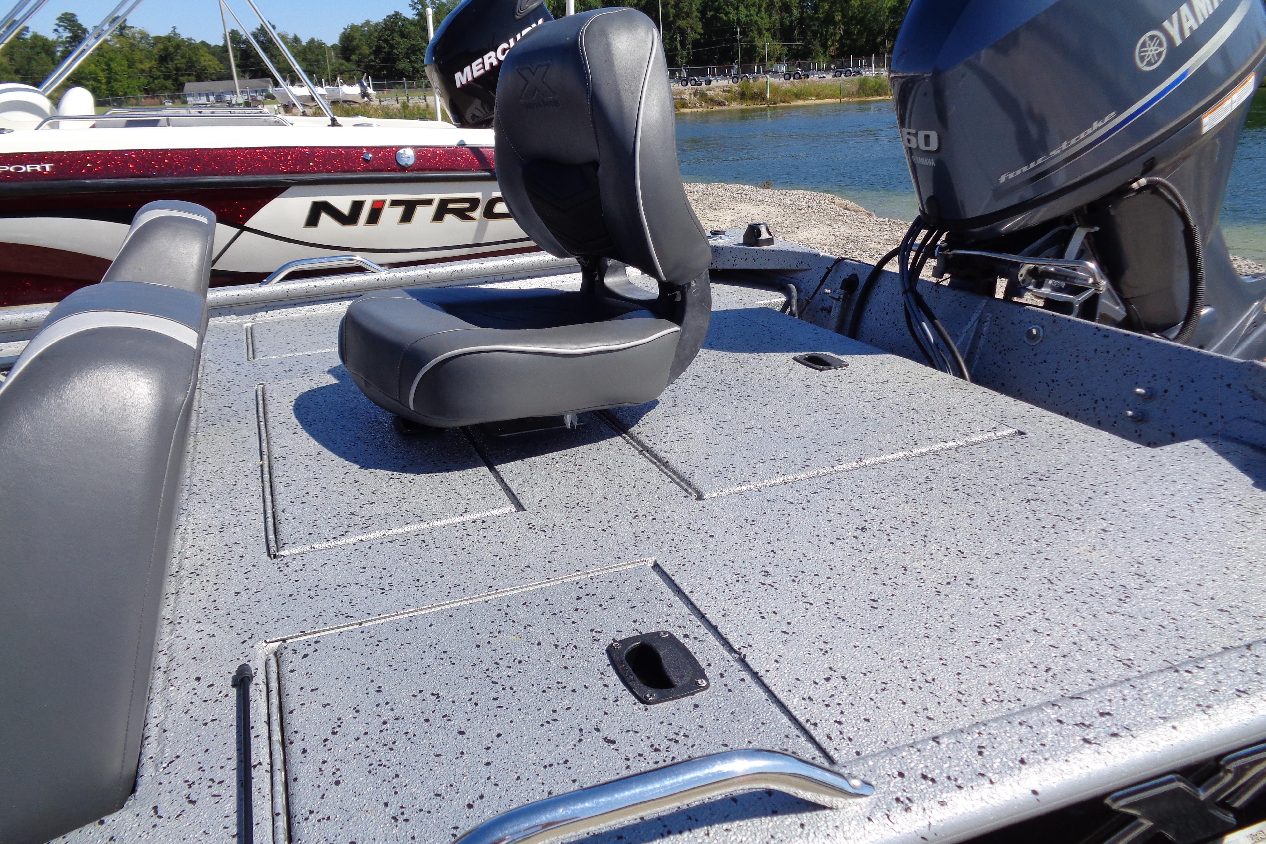 2016 Express PT175 boat deck with seating and Yamaha motor, near water.