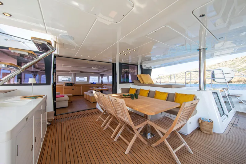  Yacht Photos Pics Luxurious 2024 Lagoon 620 NEO yacht interior with elegant dining area and scenic views.