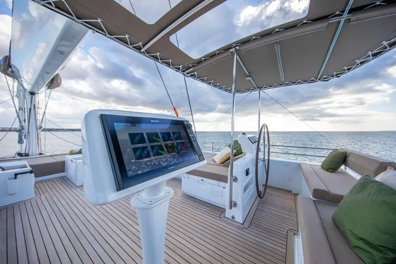  Yacht Photos Pics Luxurious 2024 Lagoon 620 NEO yacht deck with modern navigation system and ocean view.