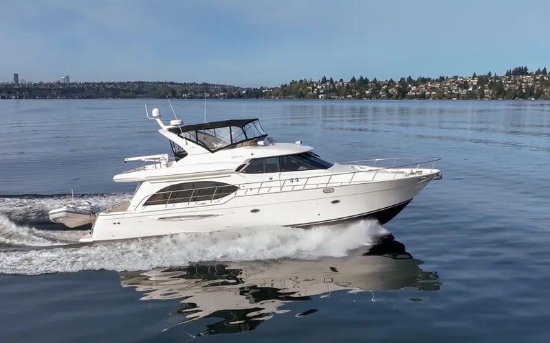 Persistence Yacht Photos Pics 2010 Meridian 580 Pilothouse yacht cruising on a calm lake.