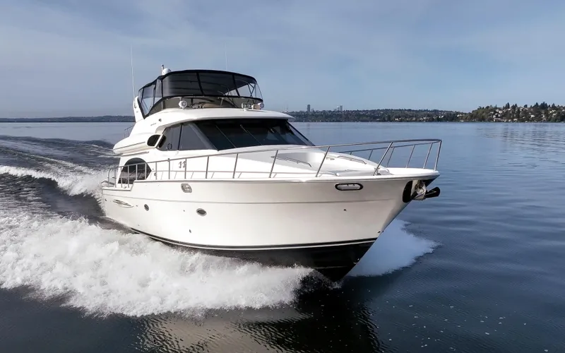 Persistence Yacht Photos Pics 2010 Meridian 580 Pilothouse yacht cruising on calm waters.