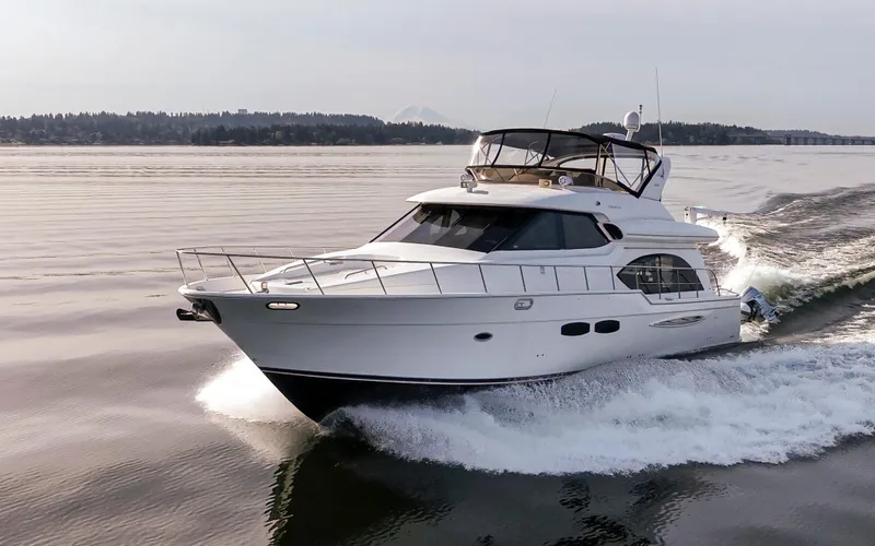 Persistence Yacht Photos Pics Luxurious 2010 Meridian 580 Pilothouse yacht cruising on calm waters.