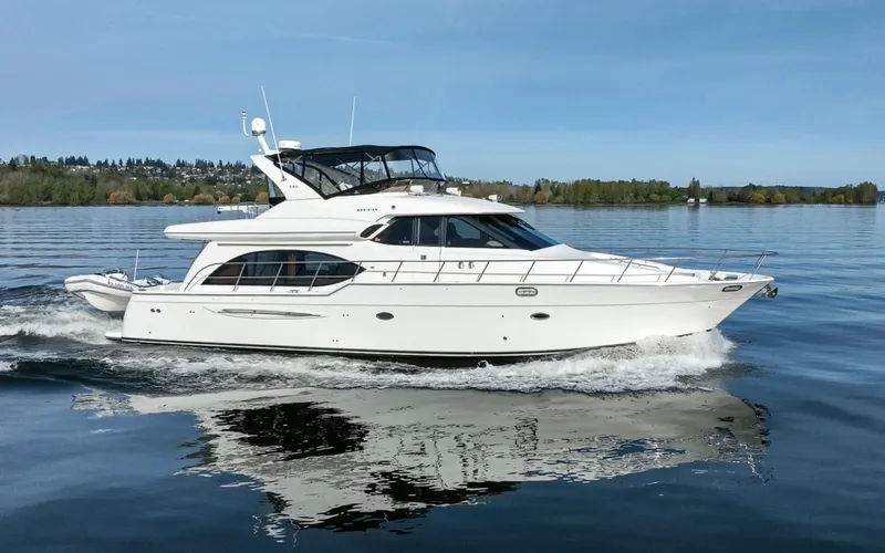 Persistence Yacht Photos Pics 2010 Meridian 580 Pilothouse yacht cruising on a calm lake.