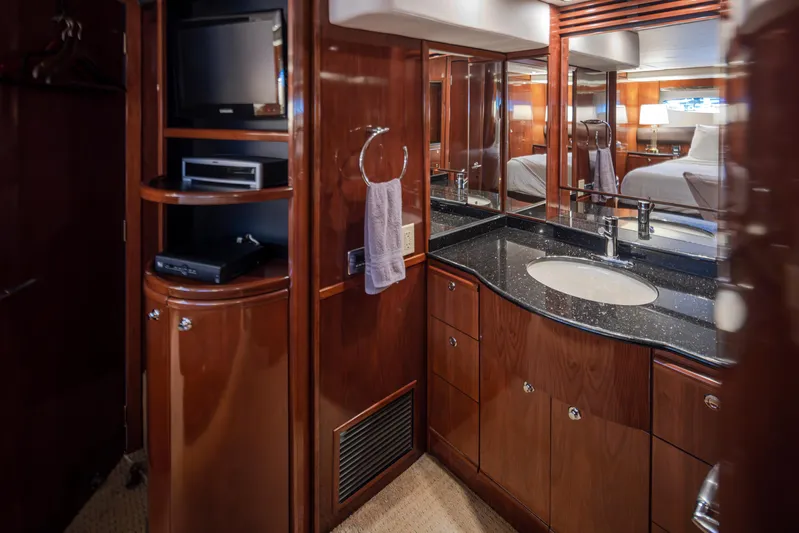 Persistence Yacht Photos Pics Luxurious bathroom interior of 2010 Meridian 580 Pilothouse yacht with wood cabinetry and modern amenities.