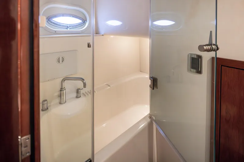 Persistence Yacht Photos Pics Luxurious bathroom in 2010 Meridian 580 Pilothouse yacht with modern fixtures.