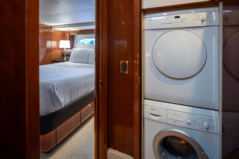 Persistence Yacht Photos Pics Bedroom and laundry area inside 2010 Meridian 580 Pilothouse yacht.