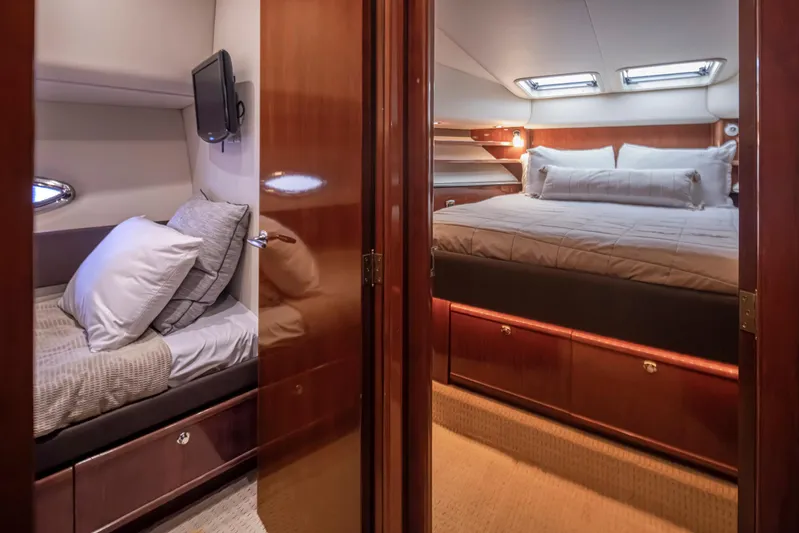 Persistence Yacht Photos Pics Luxurious interior of 2010 Meridian 580 Pilothouse yacht with cozy bedrooms.