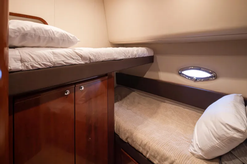 Persistence Yacht Photos Pics Cozy cabin with bunk beds in 2010 Meridian 580 Pilothouse yacht.