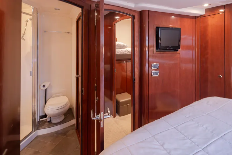 Persistence Yacht Photos Pics Luxurious interior of 2010 Meridian 580 Pilothouse yacht with bathroom and bedroom.