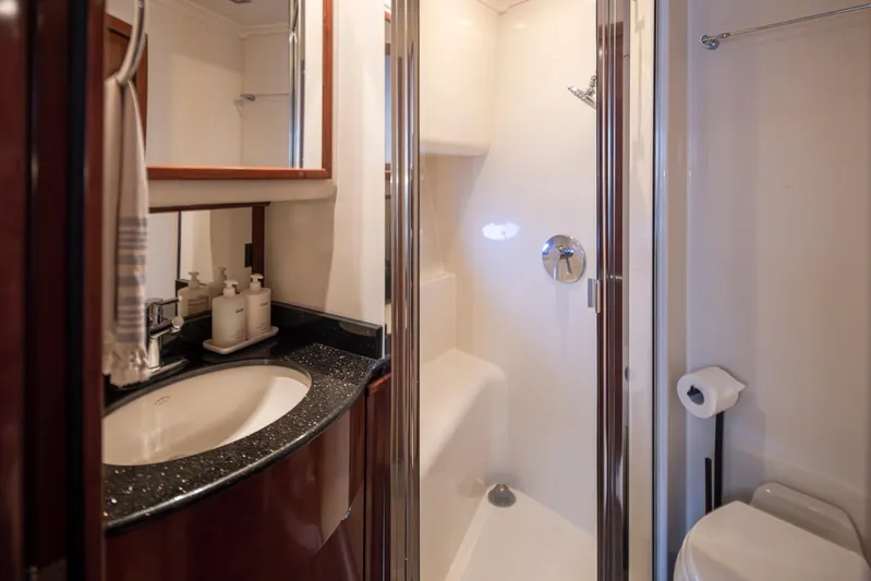 Persistence Yacht Photos Pics Luxurious bathroom in 2010 Meridian 580 Pilothouse yacht with modern fixtures.