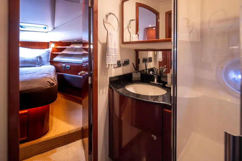 Persistence Yacht Photos Pics Luxurious bathroom and bedroom interior of 2010 Meridian 580 Pilothouse yacht.