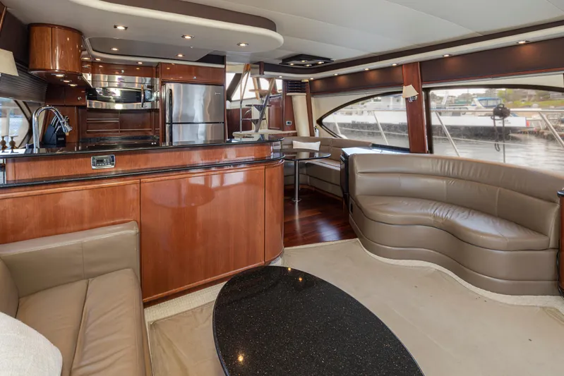 Persistence Yacht Photos Pics Luxurious interior of 2010 Meridian 580 Pilothouse yacht with modern kitchen and seating area.