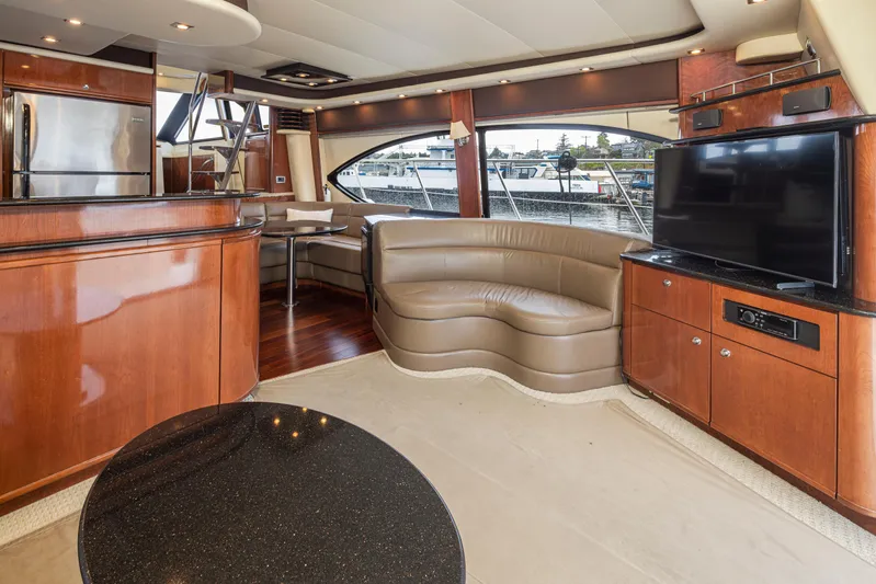 Persistence Yacht Photos Pics Luxurious interior of 2010 Meridian 580 Pilothouse yacht with leather seating and modern amenities.