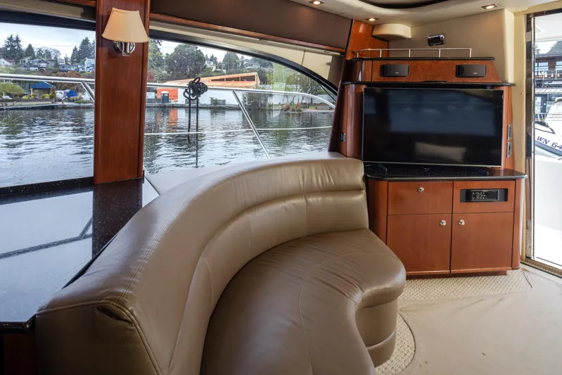 Persistence Yacht Photos Pics Luxurious interior of 2010 Meridian 580 Pilothouse yacht with leather seating and large window view.