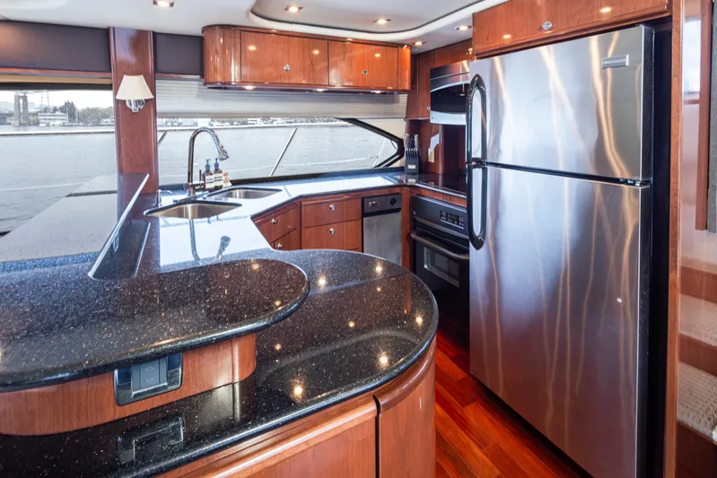 Persistence Yacht Photos Pics Luxurious kitchen interior of 2010 Meridian 580 Pilothouse yacht with modern appliances.