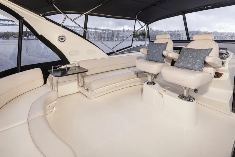 Persistence Yacht Photos Pics Luxurious interior of 2010 Meridian 580 Pilothouse yacht with plush seating and scenic views.