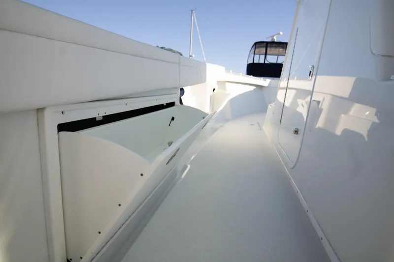  Yacht Photos Pics 2024 Yellowfin 39 boat deck with sleek white design and spacious walkway.