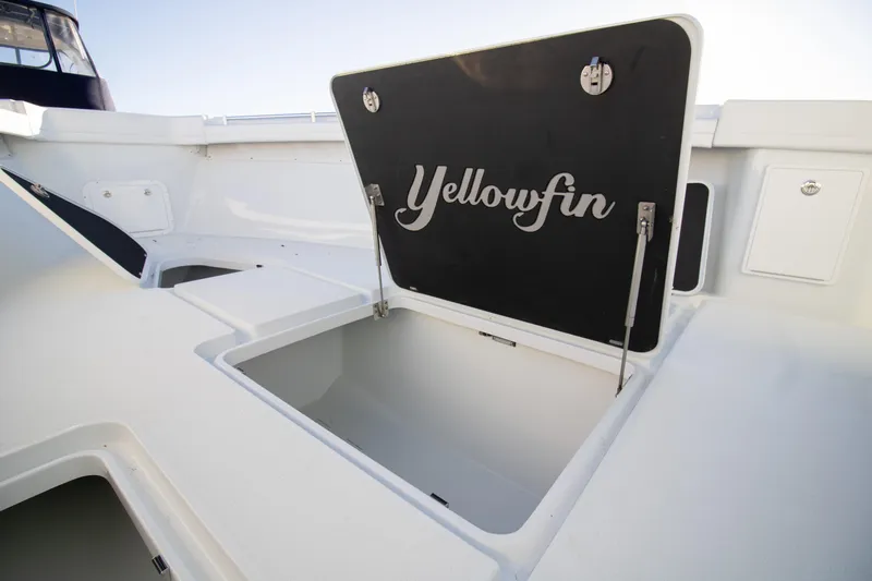  Yacht Photos Pics 2024 Yellowfin 39 boat storage compartment open, showcasing spacious interior.