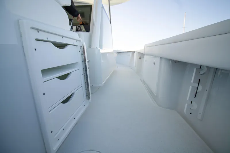  Yacht Photos Pics 2024 Yellowfin 39 boat interior with storage compartments and sleek design.